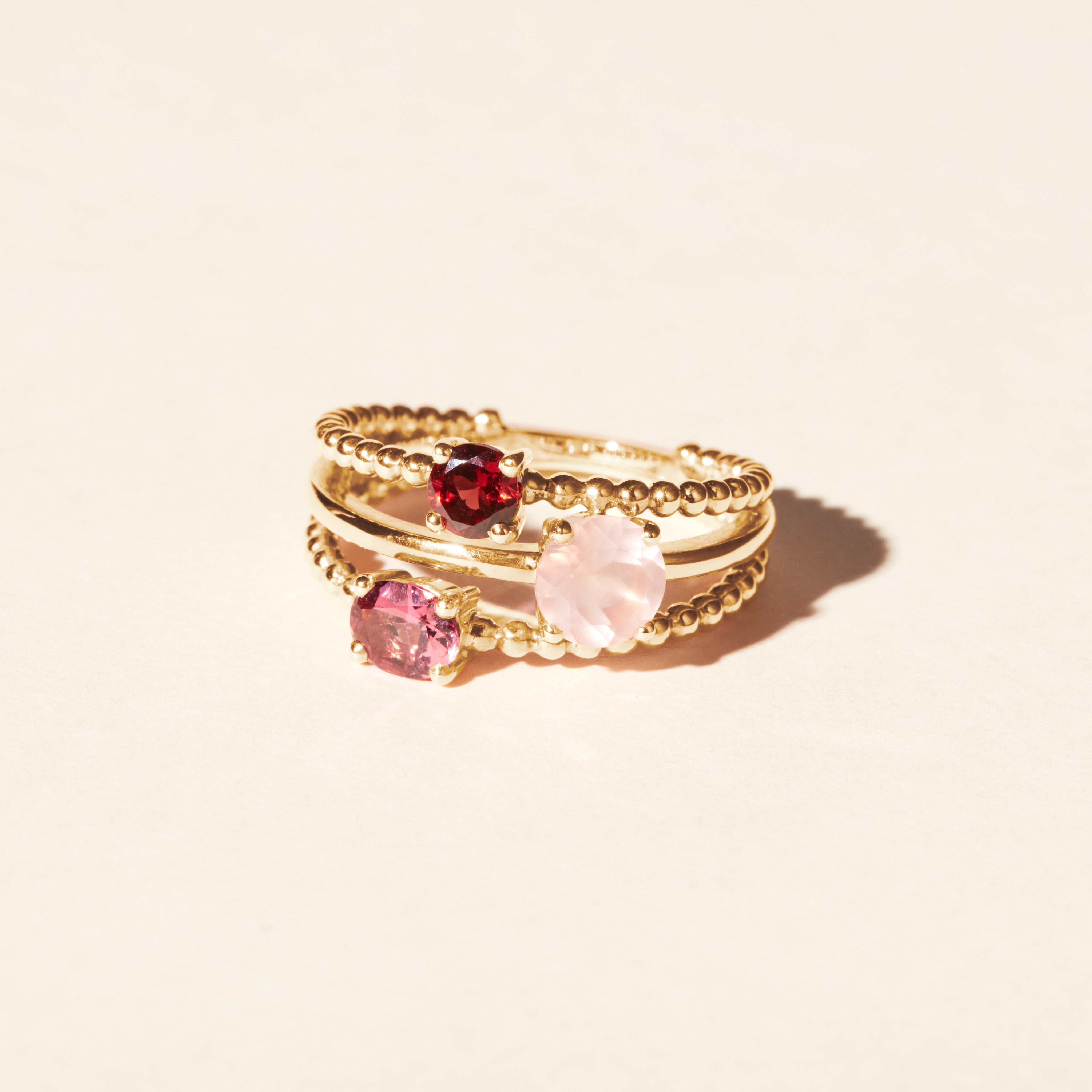 Alma Trio ring with rose quartz, tourmaline, and garnet - Yellow gold